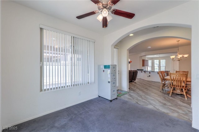 3813 Jasmine Heights Ave, North Las Vegas, NV 89081 - spare room featuring ceiling fan, arched walkways, and a chandelier