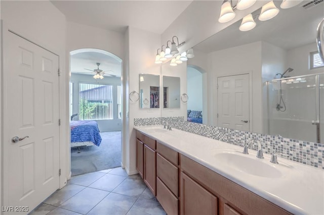 3813 Jasmine Heights Ave, North Las Vegas, NV 89081 - ensuite bathroom featuring plenty of natural light, double vanity, a stall shower, and tile patterned floors
