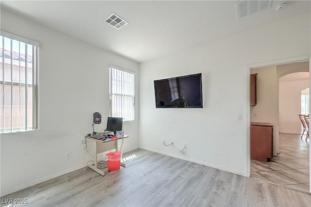 3813 Jasmine Heights Ave, North Las Vegas, NV 89081 - office with arched walkways and light wood-style floors