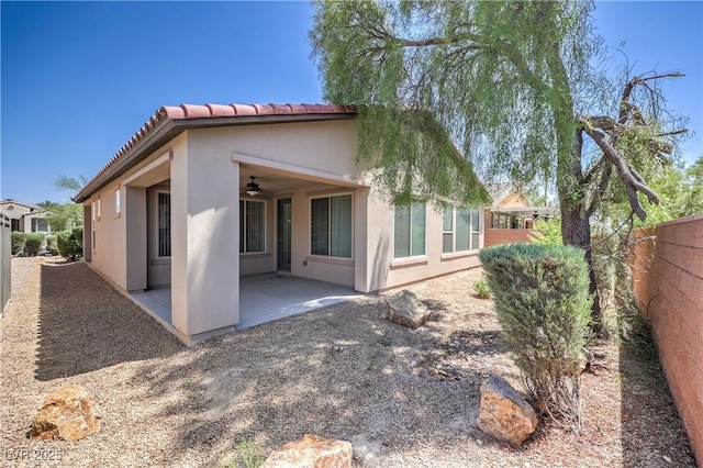 3813 Jasmine Heights Ave, North Las Vegas, NV 89081 - rear view of property featuring a patio area, stucco siding, ceiling fan, and a tiled roof
