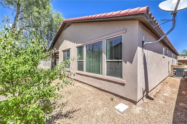 3813 Jasmine Heights Ave, North Las Vegas, NV 89081 - view of home's exterior with stucco siding and a tile roof