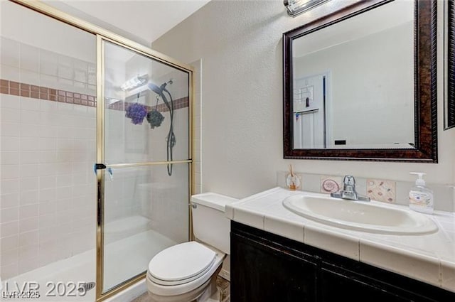 1600 N Torrey Pines Dr Unit 202, Las Vegas, NV 89108 - full bathroom with a stall shower, vanity, and a textured wall