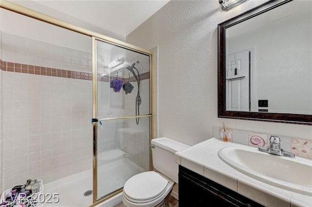 1600 N Torrey Pines Dr Unit 202, Las Vegas, NV 89108 - bathroom with a stall shower, vanity, and a textured wall
