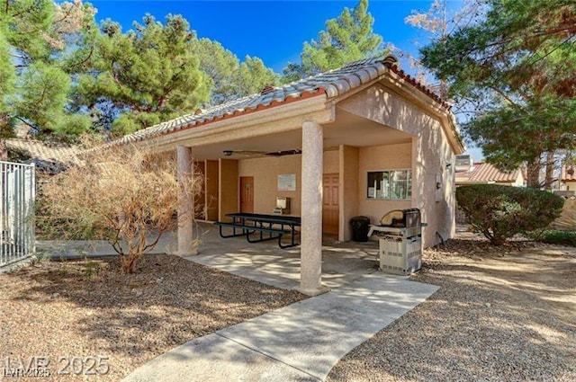 1600 N Torrey Pines Dr Unit 202, Las Vegas, NV 89108 - back of house featuring a tiled roof, a patio, and stucco siding