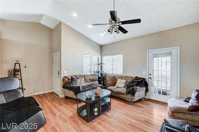 1600 N Torrey Pines Dr Unit 202, Las Vegas, NV 89108 - living area with a ceiling fan, healthy amount of natural light, light wood finished floors, a textured ceiling, and high vaulted ceiling