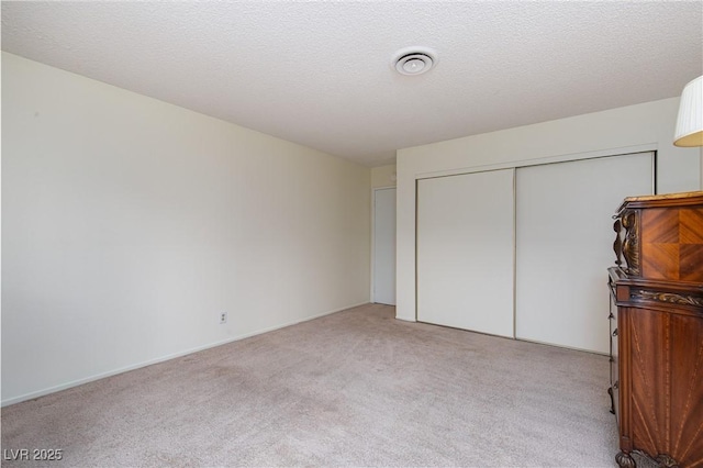 2157 Mccoig Ave, Las Vegas, NV 89119 - unfurnished bedroom with light carpet and a closet