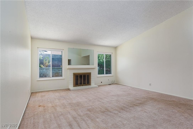 2157 Mccoig Ave, Las Vegas, NV 89119 - unfurnished living room with carpet, a textured ceiling, and a fireplace
