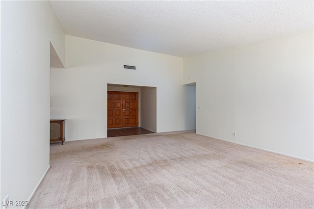 2157 Mccoig Ave, Las Vegas, NV 89119 - spare room with vaulted ceiling and carpet floors