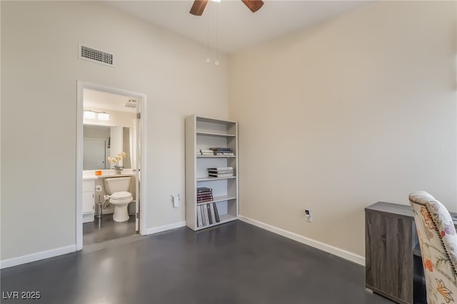 7048 Harbor View Dr, Las Vegas, NV 89119 - bedroom featuring concrete floors, an office area, ensuite bathroom, and ceiling fan