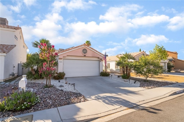 7048 Harbor View Dr, Las Vegas, NV 89119 - mediterranean / spanish-style home featuring driveway, an attached garage, stucco siding, and a tile roof