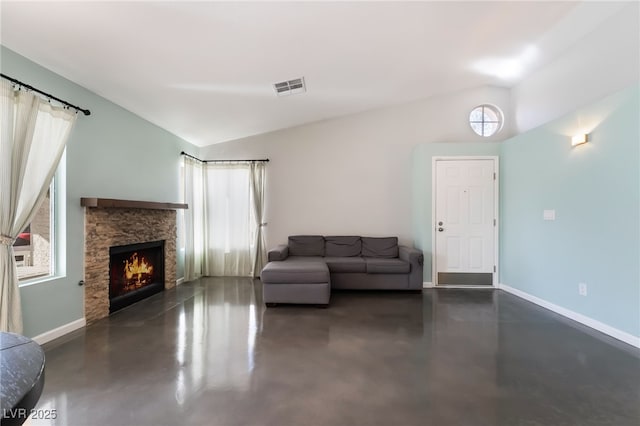 7048 Harbor View Dr, Las Vegas, NV 89119 - living area featuring lofted ceiling, finished concrete floors, healthy amount of natural light, and a fireplace