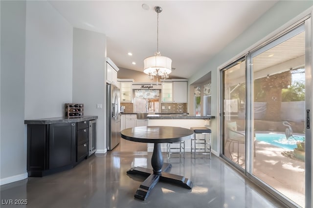 7048 Harbor View Dr, Las Vegas, NV 89119 - dining area with a chandelier, recessed lighting, and concrete floors