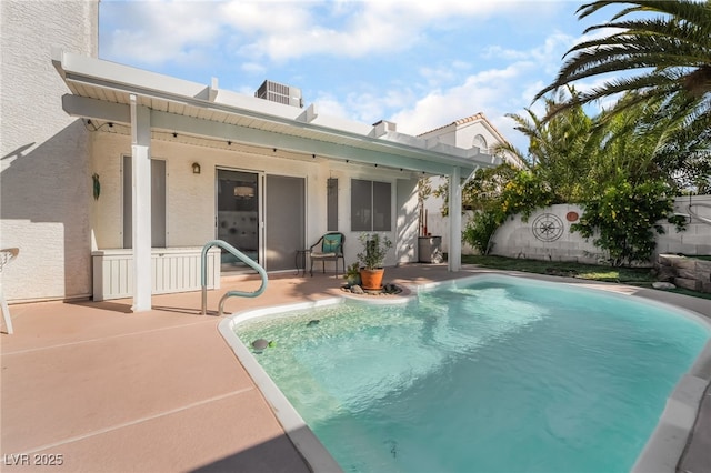 7048 Harbor View Dr, Las Vegas, NV 89119 - back of property with a patio area, a fenced backyard, an outdoor pool, and stucco siding