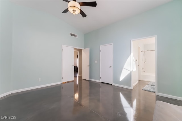 7048 Harbor View Dr, Las Vegas, NV 89119 - unfurnished bedroom with finished concrete flooring, high vaulted ceiling, ensuite bathroom, and a ceiling fan
