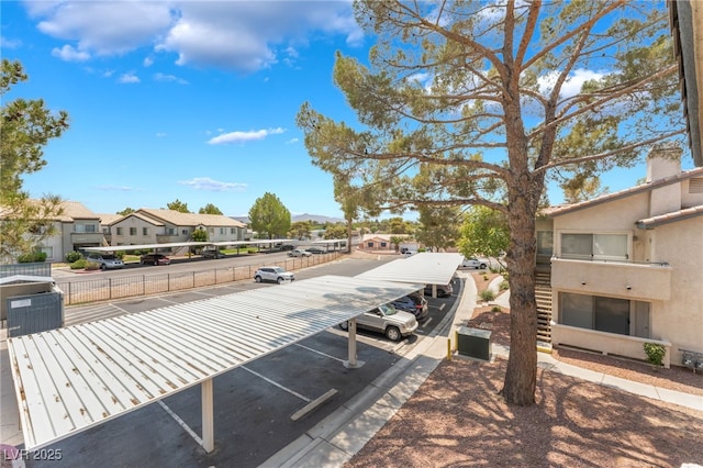 5259 Caspian Springs Dr Unit 204, Las Vegas, NV 89120 - exterior view of parking, a residential view, and stucco siding