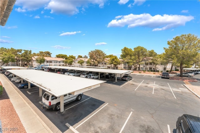 5259 Caspian Springs Dr Unit 204, Las Vegas, NV 89120 - partially covered parking lot featuring a residential view