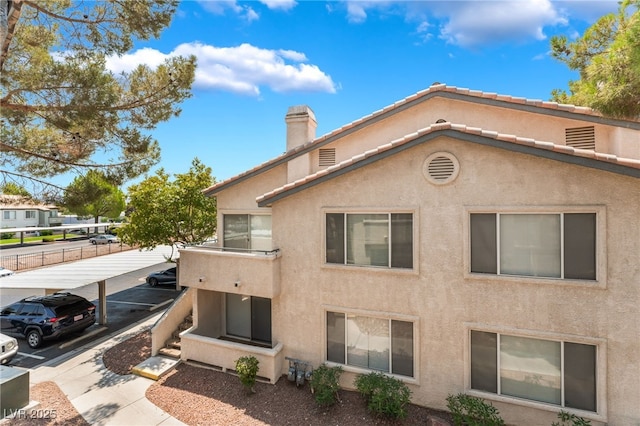 5259 Caspian Springs Dr Unit 204, Las Vegas, NV 89120 - view of building exterior featuring uncovered parking
