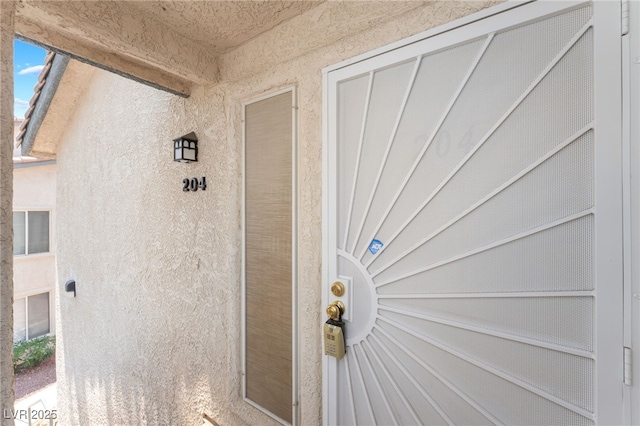 5259 Caspian Springs Dr Unit 204, Las Vegas, NV 89120 - entrance to property featuring stucco siding