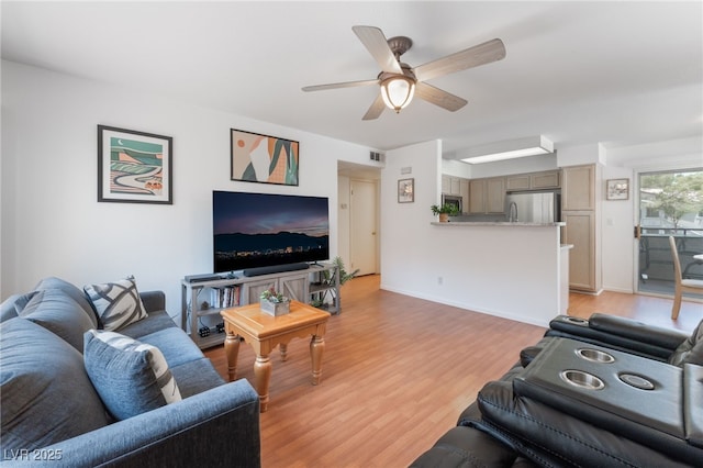 5259 Caspian Springs Dr Unit 204, Las Vegas, NV 89120 - living area featuring light wood-style flooring and a ceiling fan