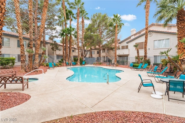 5259 Caspian Springs Dr Unit 204, Las Vegas, NV 89120 - community pool featuring a patio area and a residential view