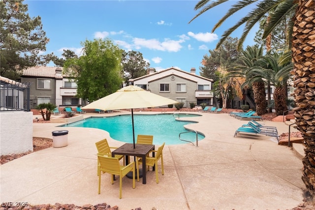 5259 Caspian Springs Dr Unit 204, Las Vegas, NV 89120 - community pool featuring a patio area