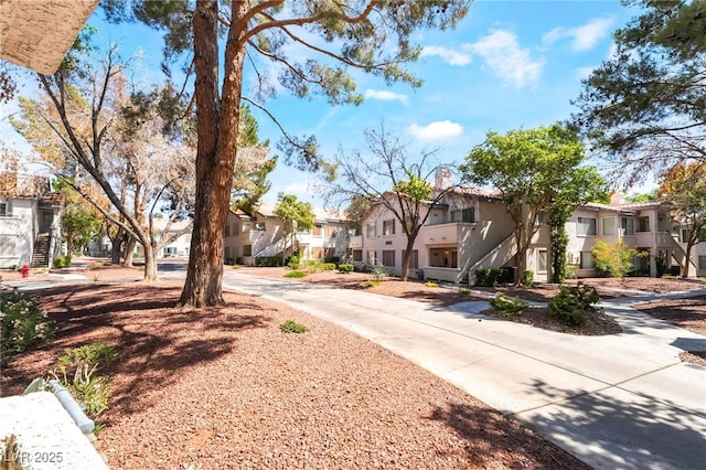 5259 Caspian Springs Dr Unit 204, Las Vegas, NV 89120 - view of concrete road with a residential view and stairs