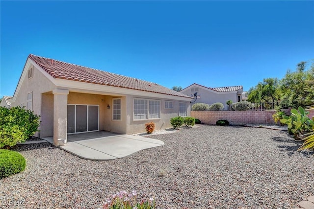 10724 Windledge Ave, Las Vegas, NV 89134 - rear view of property with stucco siding, a tile roof, and a patio area