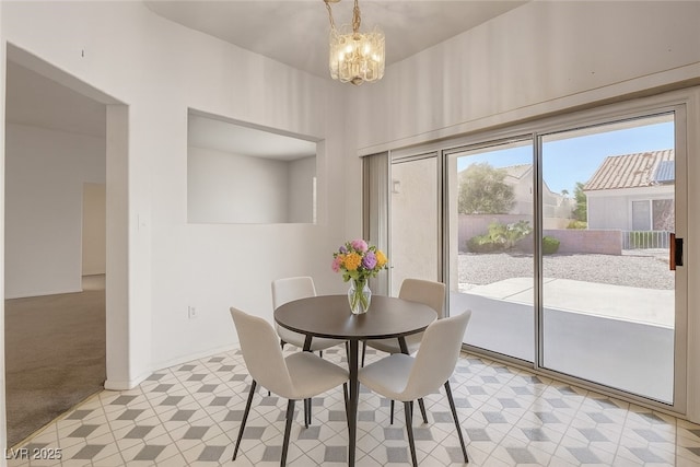 10724 Windledge Ave, Las Vegas, NV 89134 - dining area with a chandelier, light carpet, and light flooring