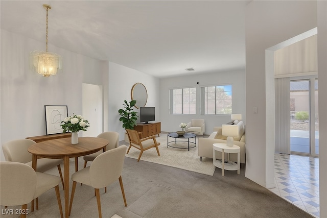 10724 Windledge Ave, Las Vegas, NV 89134 - dining space with light carpet and a chandelier