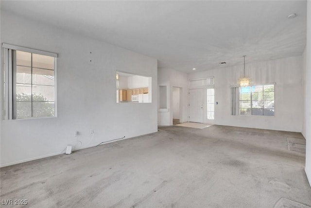 10724 Windledge Ave, Las Vegas, NV 89134 - unfurnished living room with carpet flooring and healthy amount of natural light