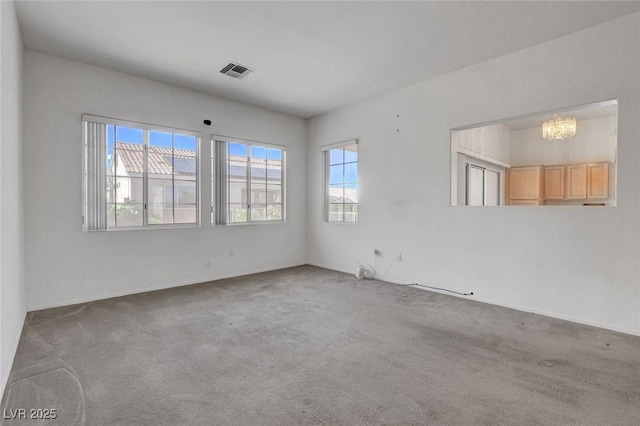 10724 Windledge Ave, Las Vegas, NV 89134 - carpeted spare room with a chandelier and baseboards