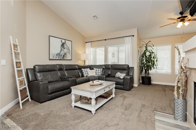 4813 W Virginia Falls Ln, Las Vegas, NV 89130 - living room with healthy amount of natural light, a ceiling fan, lofted ceiling, and a fireplace with flush hearth