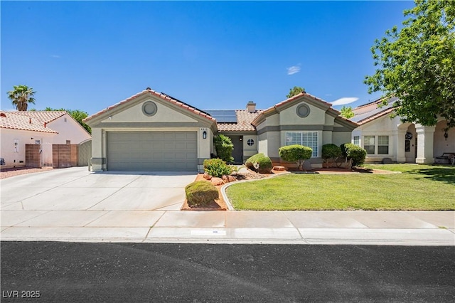 4813 W Virginia Falls Ln, Las Vegas, NV 89130 - mediterranean / spanish-style home featuring stucco siding, a tile roof, roof mounted solar panels, driveway, and a garage