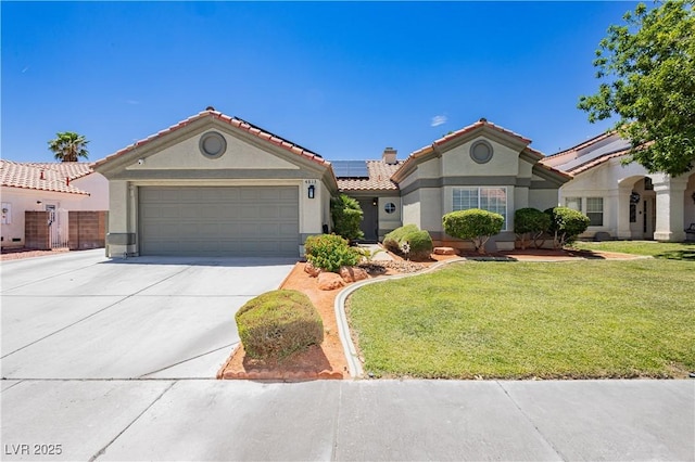 4813 W Virginia Falls Ln, Las Vegas, NV 89130 - mediterranean / spanish-style home with stucco siding, solar panels, driveway, a front yard, and an attached garage