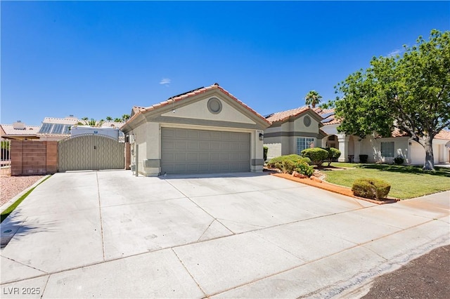 4813 W Virginia Falls Ln, Las Vegas, NV 89130 - mediterranean / spanish-style house featuring stucco siding, a gate, driveway, and an attached garage