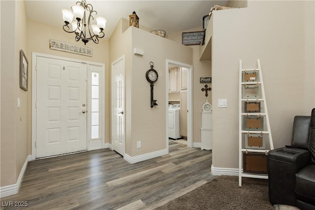 4813 W Virginia Falls Ln, Las Vegas, NV 89130 - foyer entrance with a chandelier, dark wood-style flooring, and washer / clothes dryer