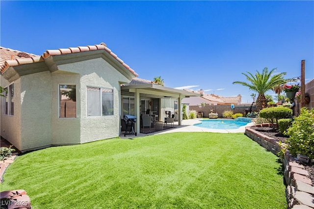 4813 W Virginia Falls Ln, Las Vegas, NV 89130 - fenced backyard featuring a patio area