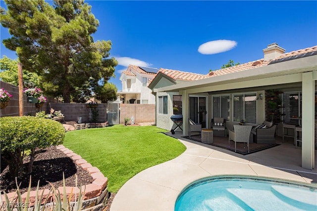 4813 W Virginia Falls Ln, Las Vegas, NV 89130 - back of house featuring a tiled roof, a fenced backyard, a patio, stucco siding, and an outdoor living space