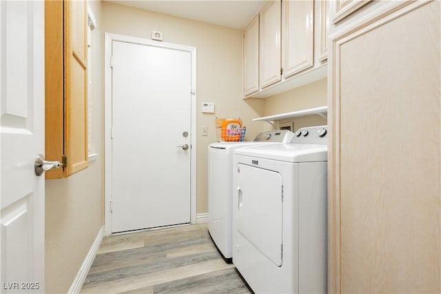 4813 W Virginia Falls Ln, Las Vegas, NV 89130 - laundry room with light wood-style floors, cabinet space, and separate washer and dryer