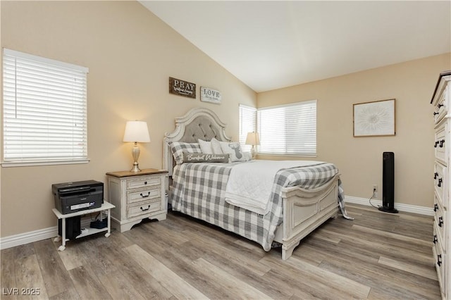 4813 W Virginia Falls Ln, Las Vegas, NV 89130 - bedroom with lofted ceiling and light wood-style floors
