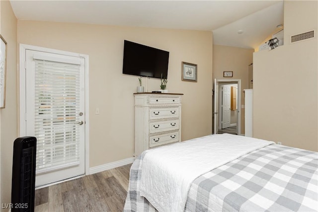 4813 W Virginia Falls Ln, Las Vegas, NV 89130 - bedroom with wood finished floors, lofted ceiling, and access to exterior
