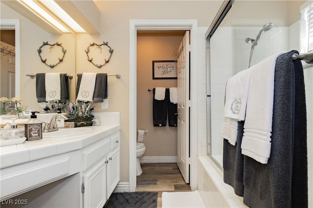 4813 W Virginia Falls Ln, Las Vegas, NV 89130 - bathroom featuring vanity, a tile shower, wood finished floors, and a bathtub