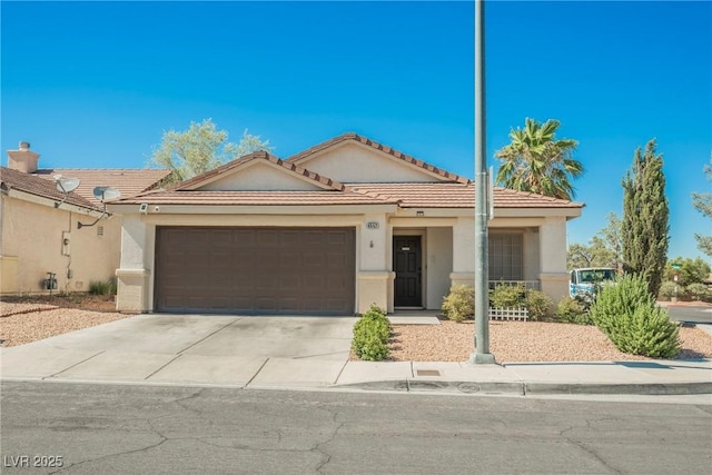 6552 Sweetzer Way, Las Vegas, NV 89108 - view of front of home with driveway, an attached garage, stucco siding, and a tiled roof