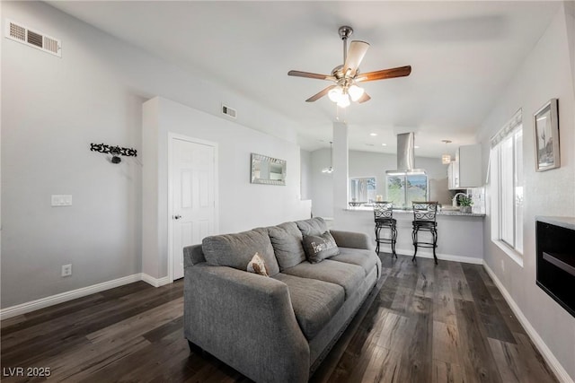 6552 Sweetzer Way, Las Vegas, NV 89108 - living area featuring dark wood-style floors, a ceiling fan, and recessed lighting