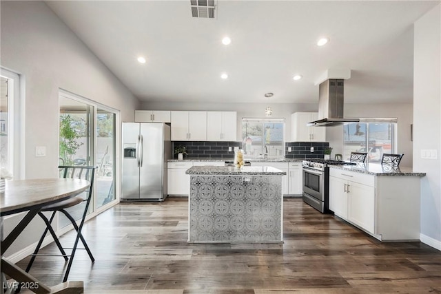 6552 Sweetzer Way, Las Vegas, NV 89108 - kitchen with appliances with stainless steel finishes, island range hood, healthy amount of natural light, a kitchen island, and recessed lighting