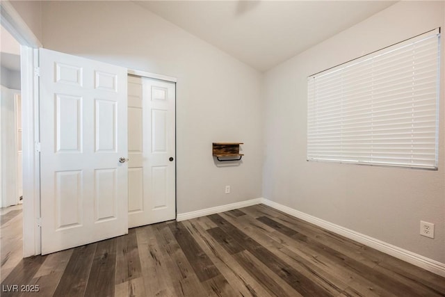 6552 Sweetzer Way, Las Vegas, NV 89108 - unfurnished bedroom with wood finished floors, a closet, and lofted ceiling