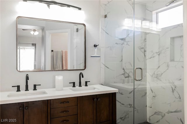 6552 Sweetzer Way, Las Vegas, NV 89108 - full bath with healthy amount of natural light, a marble finish shower, and double vanity
