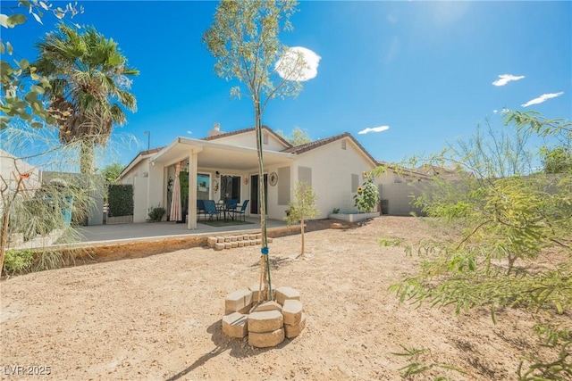 6552 Sweetzer Way, Las Vegas, NV 89108 - back of property with a patio area, stucco siding, and a fenced backyard