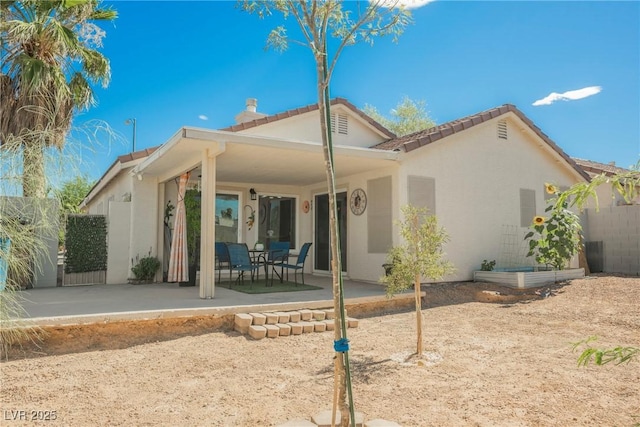 6552 Sweetzer Way, Las Vegas, NV 89108 - back of house featuring stucco siding, a patio area, and a tile roof