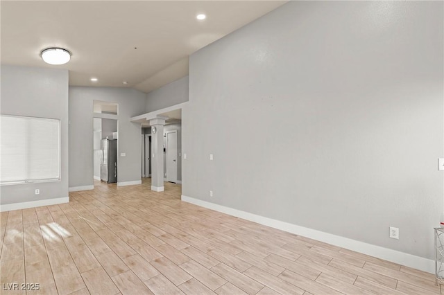 5616 Royal Castle Ln, Las Vegas, NV 89130 - empty room with ornate columns, light wood-type flooring, and recessed lighting